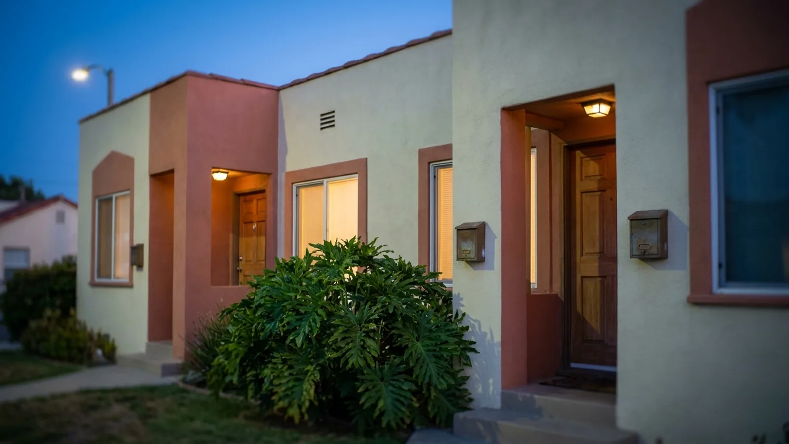 A two-unit California duplex with separate front entrances and two mailboxes
